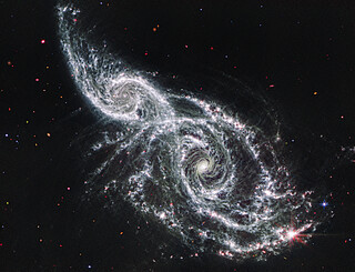 Galaxies IC 2163 and NGC 2207 (Webb MIRI image)